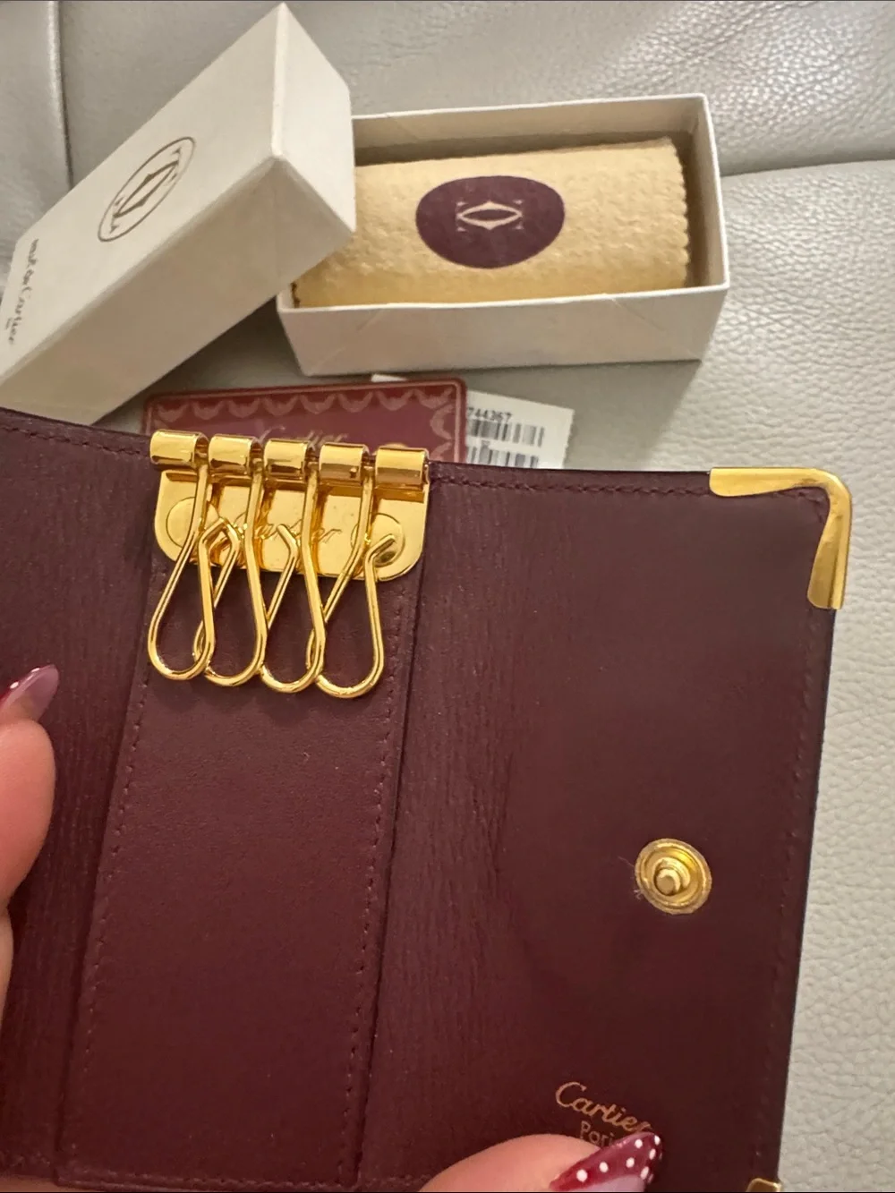 Cartier Burgundy Leather Key  Holder with Gold Accents.